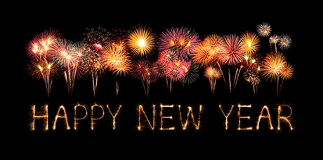 Happy New Year made of sparkles firework at night